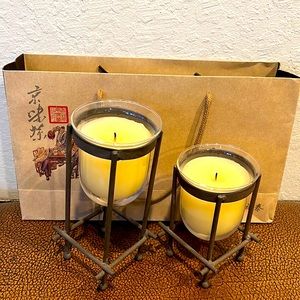 Stylized bronze/brown metal stand holders with glass filled candles so very nice